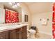 Bathroom with modern sink, dark wood vanity and vibrant shower curtain at 420 Orange St, Indianapolis, IN 46225