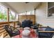 Inviting covered porch with comfortable seating, a grill, and a view of the outdoors at 420 Orange St, Indianapolis, IN 46225