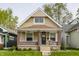Charming bungalow-style home with a welcoming front porch, brick accents, and well-maintained lawn at 420 Orange St, Indianapolis, IN 46225