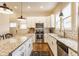 Open Kitchen features stainless steel appliances, white cabinets, and granite countertops with eat-in island at 420 Orange St, Indianapolis, IN 46225
