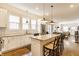 Spacious kitchen with stainless appliances, granite countertops, large island with seating, and subway tile backsplash at 420 Orange St, Indianapolis, IN 46225