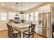 Bright kitchen features granite countertops, a large island, stainless steel appliances and white cabinetry at 420 Orange St, Indianapolis, IN 46225