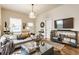 Spacious living room featuring a comfortable sofa, stylish decor, hardwood floors, and neutral walls at 420 Orange St, Indianapolis, IN 46225