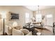 Cozy living room with a comfortable sofa, stylish armchairs, hardwood floors, and ample natural light at 420 Orange St, Indianapolis, IN 46225