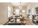 Inviting living room featuring hardwood floors, neutral walls, a comfortable sofa, and stylish décor at 420 Orange St, Indianapolis, IN 46225