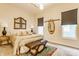 Cozy primary bedroom with a large bed, bench seating, neutral decor, and a beautiful rug at 420 Orange St, Indianapolis, IN 46225