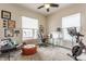 Bright office space with a modern desk, comfortable seating, exercise bike, and ample natural light at 420 Orange St, Indianapolis, IN 46225