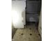 Damaged bathroom with worn flooring, toilet, and built-in tub at 425 N Grant Ave, Indianapolis, IN 46201