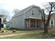 Angle view showcasing the home's facade, porch, and siding at 425 N Grant Ave, Indianapolis, IN 46201