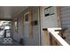 Exterior shot of a porch with no-trespassing signs on windows at 425 N Grant Ave, Indianapolis, IN 46201