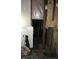 Damaged wall framing with insulation and exposed pipes at 425 N Grant Ave, Indianapolis, IN 46201