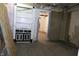 View of a living room with built-in shelving and dated decor at 425 N Grant Ave, Indianapolis, IN 46201