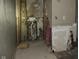 A look at a space undergoing renovation, walls with peeling paint and bare spots, reflects a renovation project at 425 N Grant Ave, Indianapolis, IN 46201