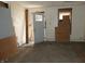 This room is under construction with boarded windows and doors, as well as exposed walls and flooring at 425 N Grant Ave, Indianapolis, IN 46201