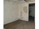 A room showcasing exposed walls, damaged plaster, and peeling paint, reflecting its current state of disrepair at 425 N Grant Ave, Indianapolis, IN 46201