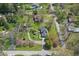 Aerial view of property showcasing lush greenery, circular driveway, and peaceful neighborhood at 4337 Lincoln Rd, Indianapolis, IN 46228