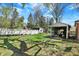 A large backyard features grass and a storage building with a metal garage at 4337 Lincoln Rd, Indianapolis, IN 46228