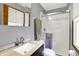 Bathroom featuring a new vanity, shower, and updated fixtures for a refreshed modern style at 4337 Lincoln Rd, Indianapolis, IN 46228