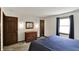 Comfortable bedroom with natural light, stylish dresser, and modern fixtures create a relaxing space at 4337 Lincoln Rd, Indianapolis, IN 46228