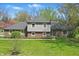 Charming brick and siding home featuring a well-maintained lawn and inviting curb appeal at 4337 Lincoln Rd, Indianapolis, IN 46228