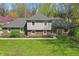 Beautiful two-story brick home with manicured lawn, mature trees, and a welcoming entrance at 4337 Lincoln Rd, Indianapolis, IN 46228