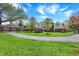 Beautiful home with a circular driveway, charming gazebo, mature trees, lush lawn, and detached garage at 4337 Lincoln Rd, Indianapolis, IN 46228