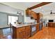 Kitchen features stainless steel appliances, granite countertops, an island, and tile backsplash at 4337 Lincoln Rd, Indianapolis, IN 46228