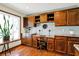 Kitchen desk and bar area features custom cabinetry and granite countertops next to a window at 4337 Lincoln Rd, Indianapolis, IN 46228