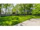 Well-maintained backyard featuring a large green lawn and a sturdy wooden fence at 4343 N Pennsylvania St, Indianapolis, IN 46205