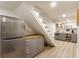 Finished basement with bar area featuring grey cabinetry, and stainless steel appliances at 4343 N Pennsylvania St, Indianapolis, IN 46205