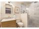 Elegant bathroom with marble shower, stylish vanity, framed mirror, and a sleek design at 4343 N Pennsylvania St, Indianapolis, IN 46205
