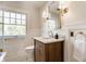 Bathroom featuring a wood vanity, modern fixtures, and designer finishes at 4343 N Pennsylvania St, Indianapolis, IN 46205