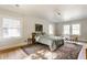 Bright bedroom featuring hardwood floors, an area rug, and a soothing color palette at 4343 N Pennsylvania St, Indianapolis, IN 46205