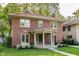 Attractive brick house with a red tile roof, covered entryway, and lush green lawn at 4343 N Pennsylvania St, Indianapolis, IN 46205