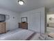 Bedroom with white walls, plush carpet, dresser, closet and en-suite bathroom at 4412 Mountbatten Ct, Indianapolis, IN 46254