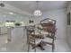 Bright dining area featuring a wooden table, chairs, and decorative chandelier at 4412 Mountbatten Ct, Indianapolis, IN 46254