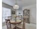 Bright dining area with natural light and a view into a living room space at 4412 Mountbatten Ct, Indianapolis, IN 46254