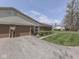 Brick and vinyl single story home with a two-car garage and landscaped front yard at 4412 Mountbatten Ct, Indianapolis, IN 46254