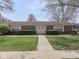 Charming brick home with manicured lawn and symmetrical landscaping at 4412 Mountbatten Ct, Indianapolis, IN 46254
