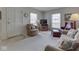 Inviting living room featuring plush furniture, large windows and neutral carpet at 4412 Mountbatten Ct, Indianapolis, IN 46254