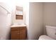 Functional half-bathroom with a vanity, a mirror, and a toilet, all in a clean and well-lit space at 4545 Connaught East Dr, Plainfield, IN 46168