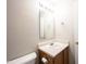 This bathroom features a vanity with sink, a mirror, and a toilet at 4545 Connaught East Dr, Plainfield, IN 46168