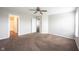 Bedroom featuring neutral paint, plush carpeting, and an attached bathroom at 4545 Connaught East Dr, Plainfield, IN 46168