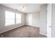 A spacious bedroom with carpeted floors and plenty of natural light from the window at 4545 Connaught East Dr, Plainfield, IN 46168