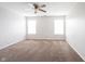 Bright and airy carpeted bedroom, complete with a ceiling fan and bright windows at 4545 Connaught East Dr, Plainfield, IN 46168
