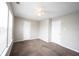 An empty bedroom features carpeted floors, a ceiling fan, and bright windows at 4545 Connaught East Dr, Plainfield, IN 46168