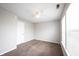 A well-lit bedroom with neutral walls, plush carpeting, and a modern ceiling fan at 4545 Connaught East Dr, Plainfield, IN 46168