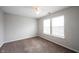 Bedroom features neutral walls, wall to wall carpet, ceiling fan, and window at 4545 Connaught East Dr, Plainfield, IN 46168