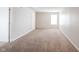 A brightly lit bonus room features plush carpeting and a large window at 4545 Connaught East Dr, Plainfield, IN 46168