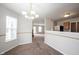Dining room featuring updated flooring and modern lighting, creating a warm and inviting atmosphere at 4545 Connaught East Dr, Plainfield, IN 46168